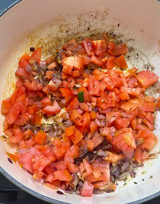 chopped tomatoes with spices in a pot