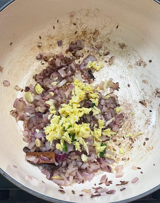 onions with ginger garlic in a pot