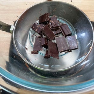 broken pieces of chocolate placed in a bowl