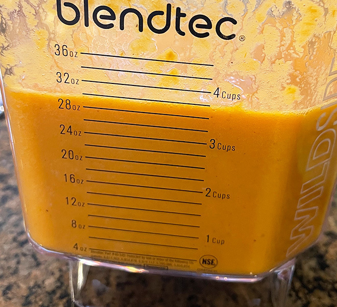blended tomato soup in a blender