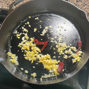 ginger, garlic and chilies in a skillet