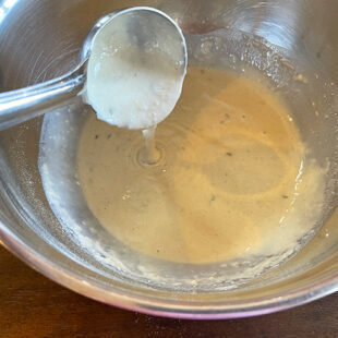 batter being poured from a ladle