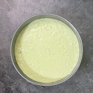 green color batter in a cake pan