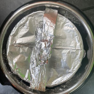 pan covered with aluminum foil placed in instant pot