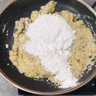 powdered sugar being added to a dough