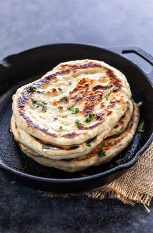 stack of naan on a iron skillet