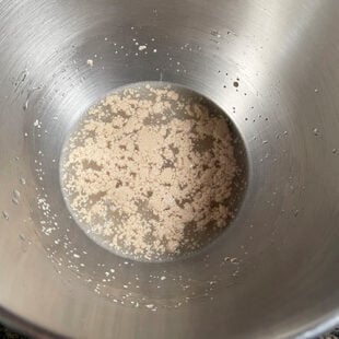 bowl with water and yeast sprinkled on top