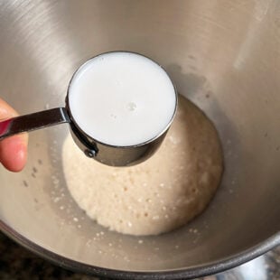 milk being added to yeast mixture