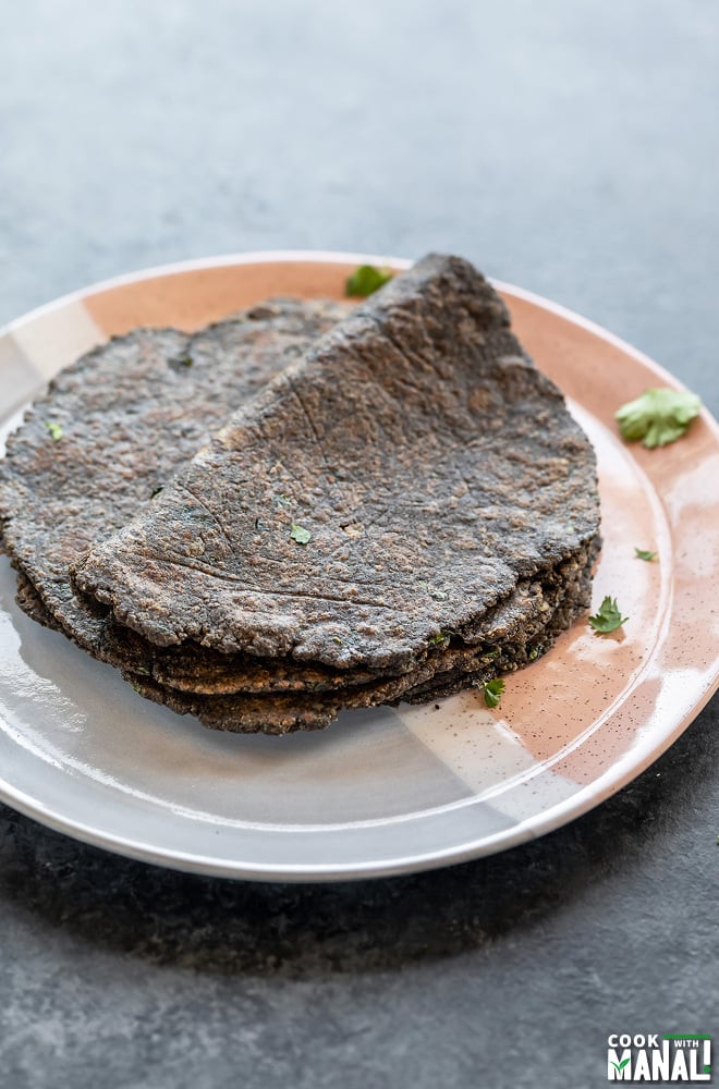 flatbreads placed on a plate with the top one folded in half