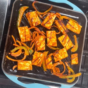 marinated paneer and veggies being grilled