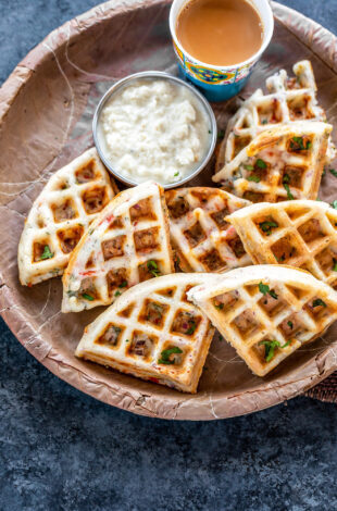 savory waffles served with coconut chutney and glass of chai
