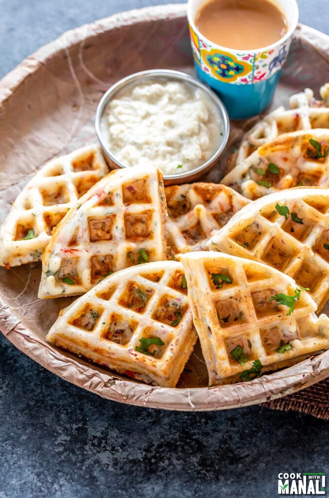 savory waffles served with coconut chutney and glass of chai