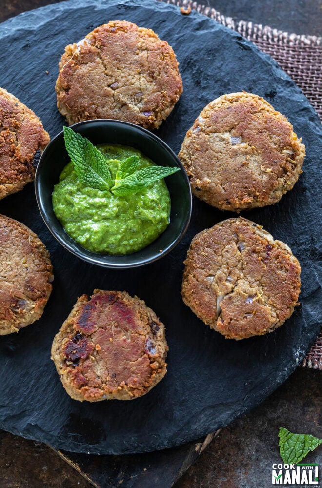 kebabs with chutney on a board