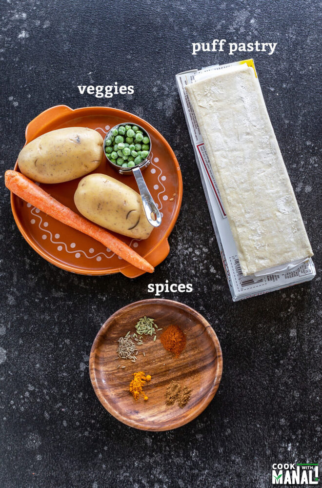 puff pastry sheet, vegetables and spices arranged on a plate