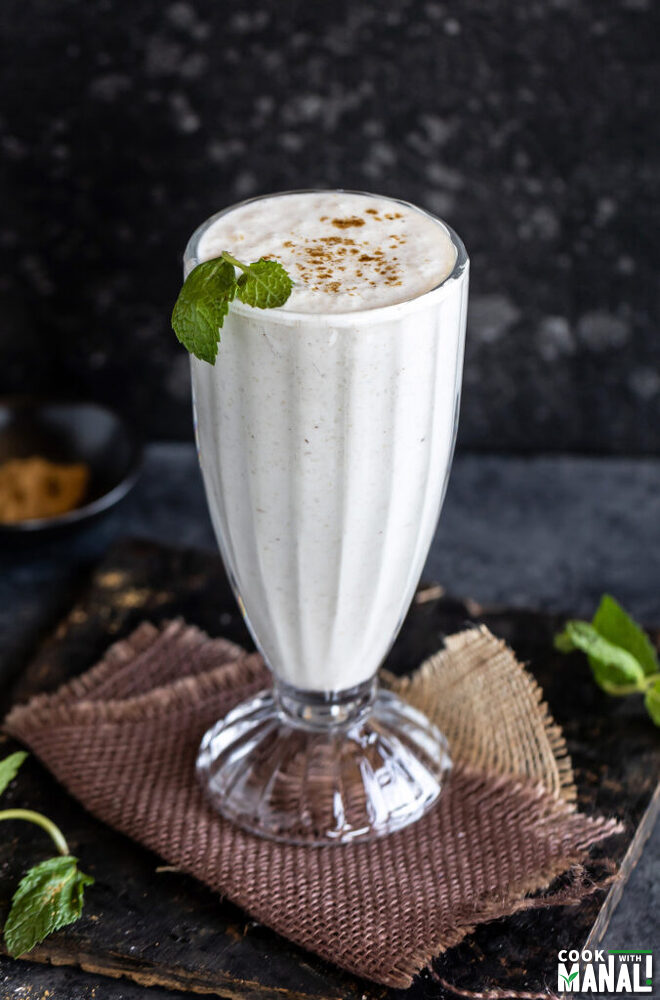glass of lassi garnished with mint leaves