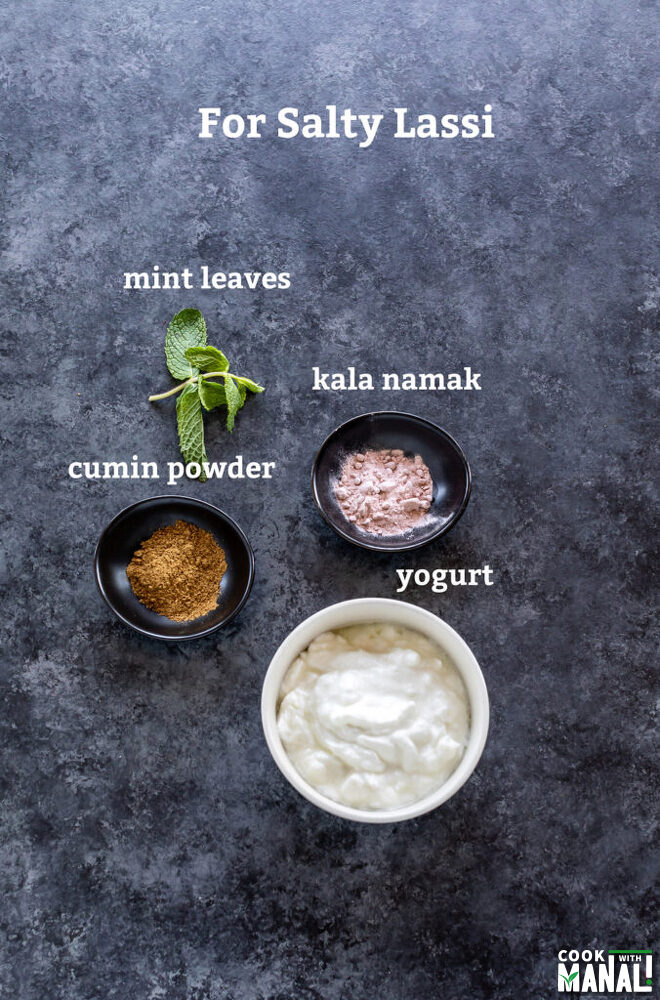 three bowls with cumin powder, kala namak and yogurt with mint leaves on the side