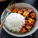 tofu served with white rice in a bowl