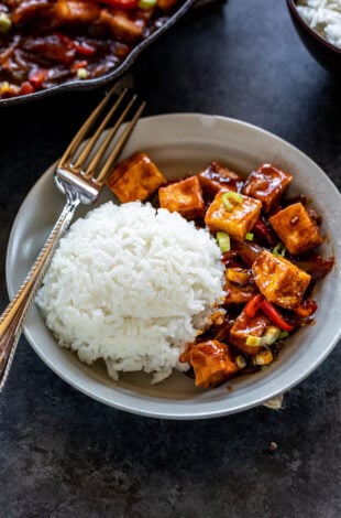tofu served with white rice in a bowl