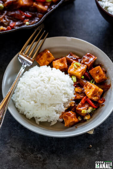tofu served with white rice in a bowl