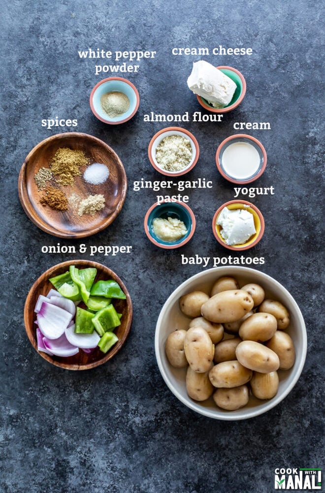 ingredients to make aloo tikka arranged on a board