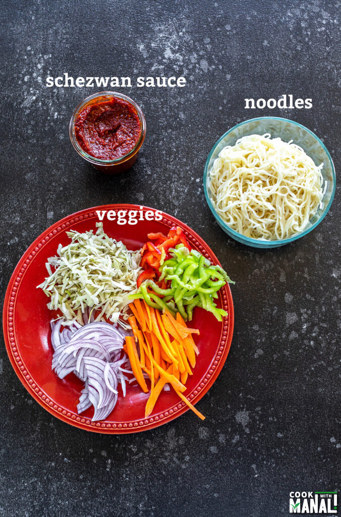 ingredients for schezwan noodles arranged on a board