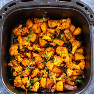 aloo gobi placed in air fryer basket