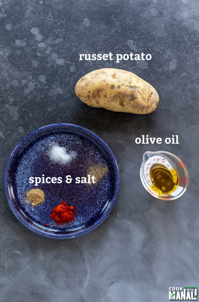 ingredients for masala fries placed on a board