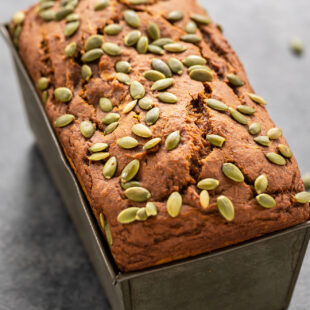 load of pumpkin bread topped with pumpkin seeds