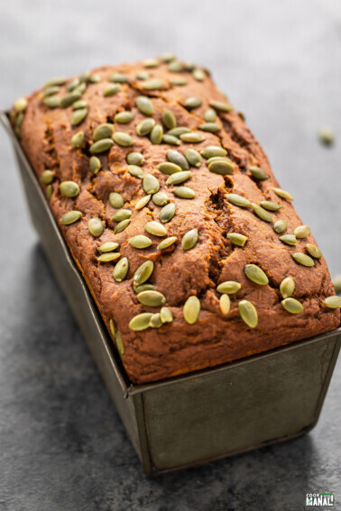 load of pumpkin bread topped with pumpkin seeds