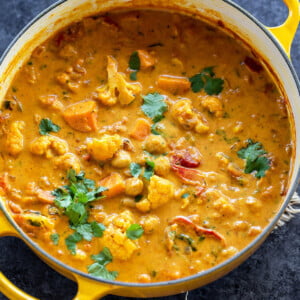 pot of curry garnished with cilantro