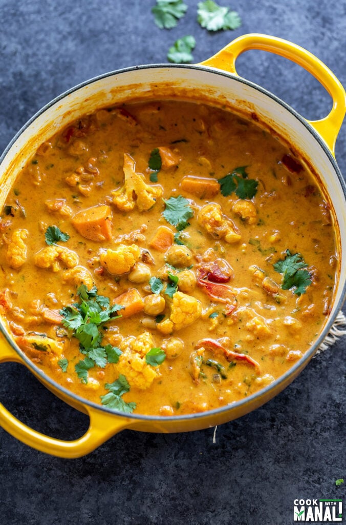 pot of curry garnished with cilantro