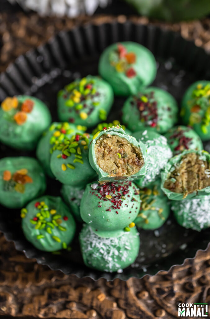 a paan cheesecake truffles cut into half to show the inside