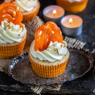 cupcakes topped with jalebi and tealights placed in the background
