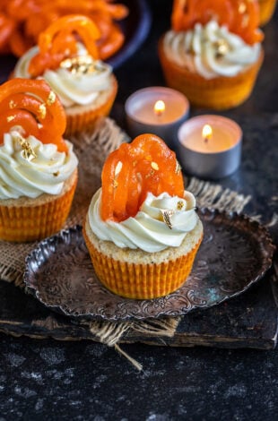 cupcakes topped with jalebi and tealights placed in the background
