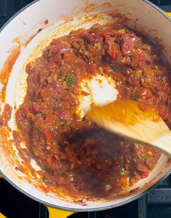 crushed tomatoes with spices in a pot