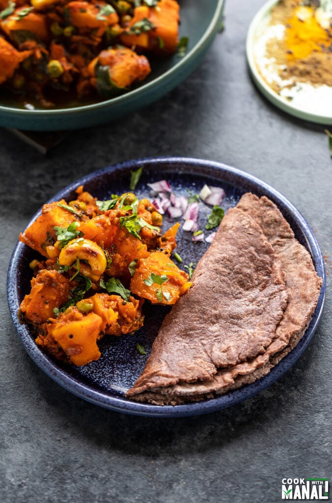 butternut squash sabzi served with ragi roti in a plate