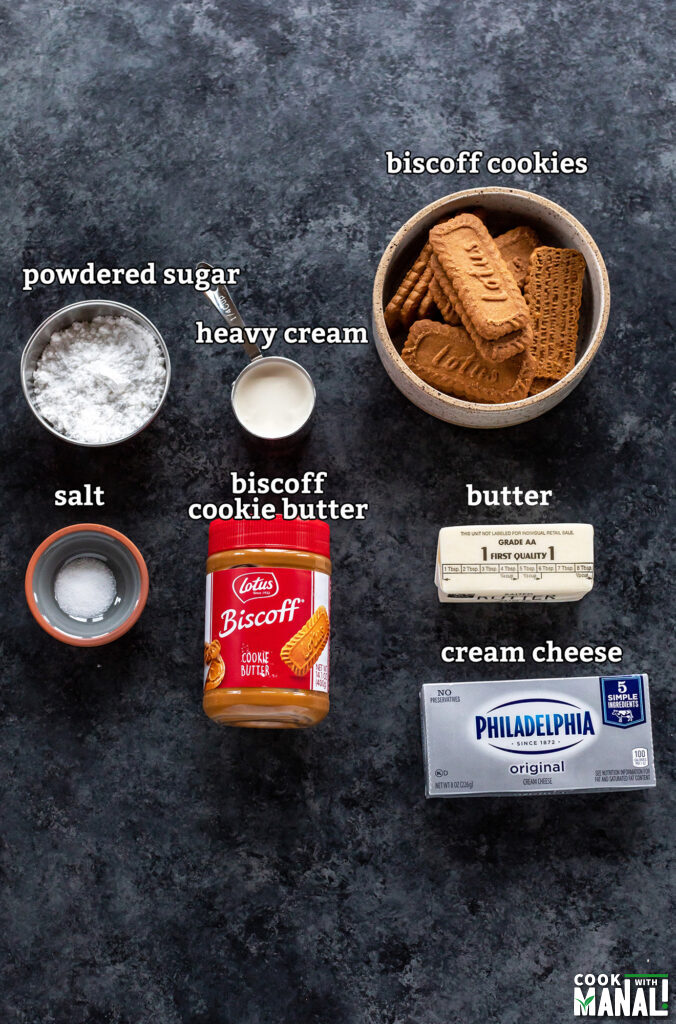ingredients for biscoff cheesecake arranged on a board