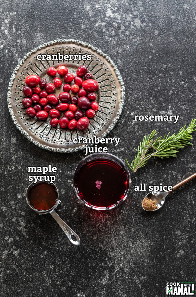 ingredients for cranberry mocktail placed on a board