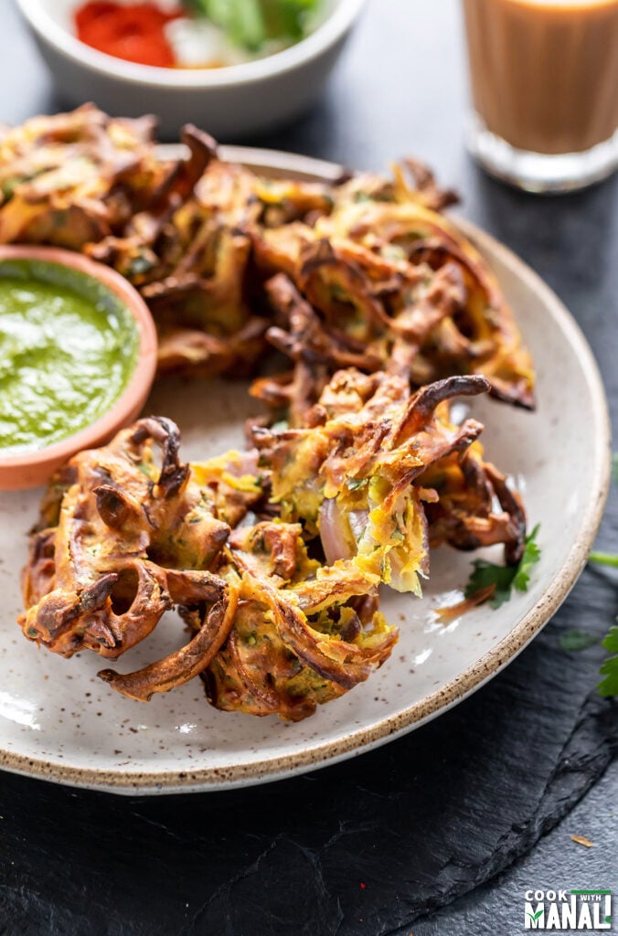 onion pakoda cut in half to show the inside