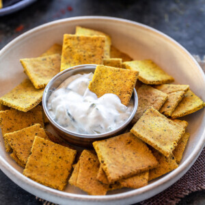 masala crackers dipped in white color sauce