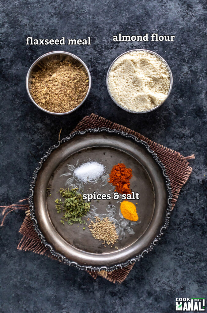 ingredients for almond flour masala crackers arranged on a board