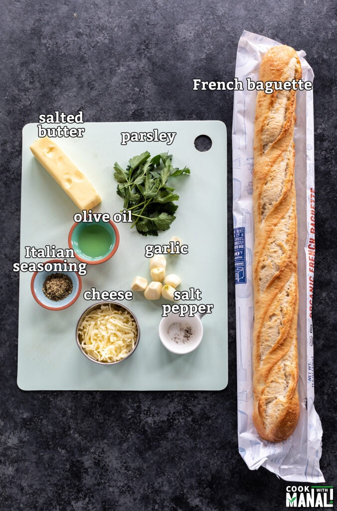 ingredients for air fryer garlic bread arranged on a board