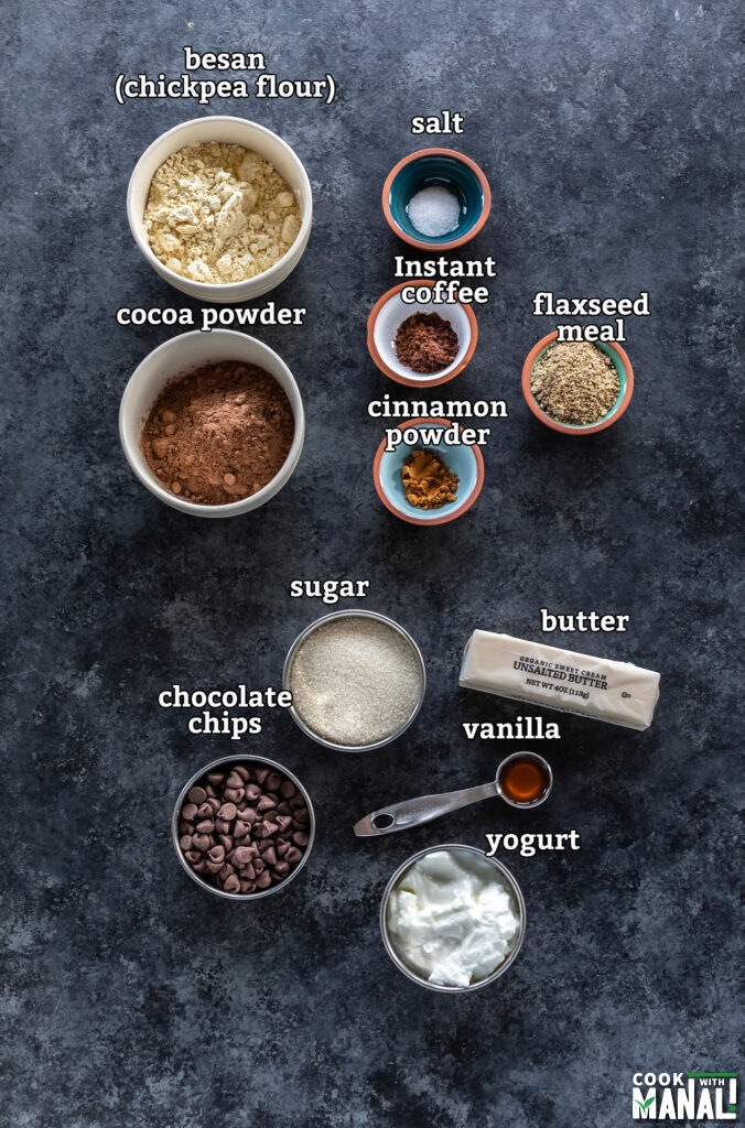 ingredients for besan brownies arranged on a board