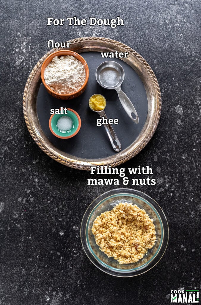 ingredients for air fryer gujiya arranged on a board