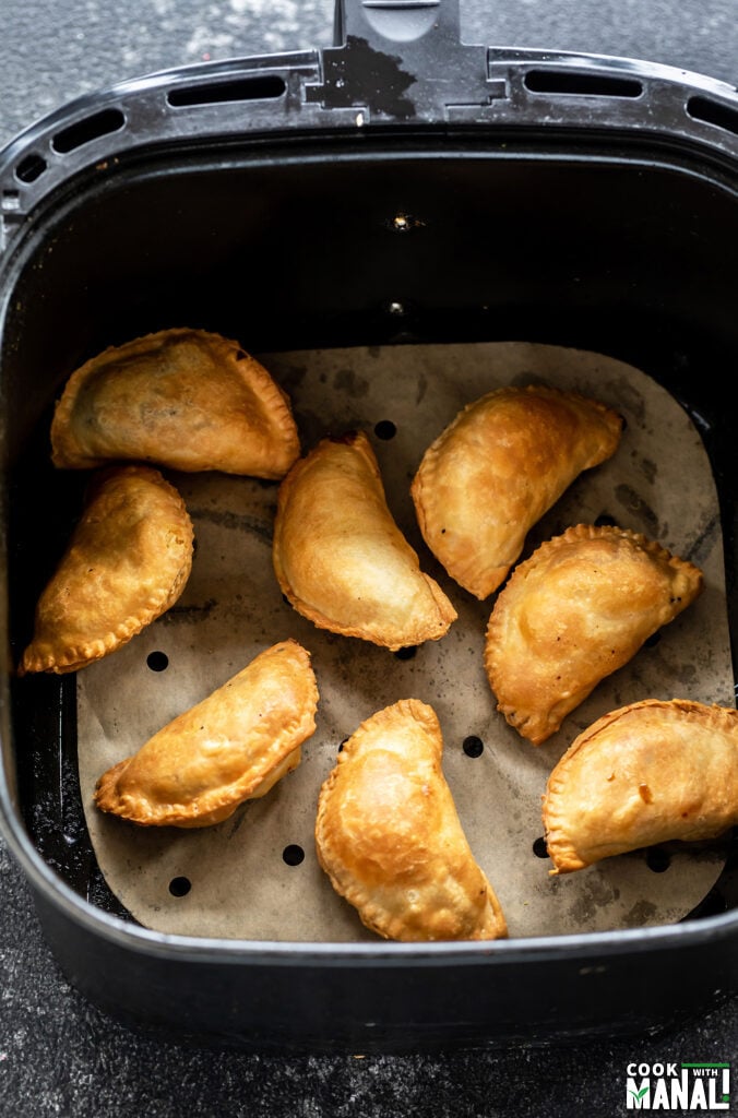 gujiyas placed in an air fryer