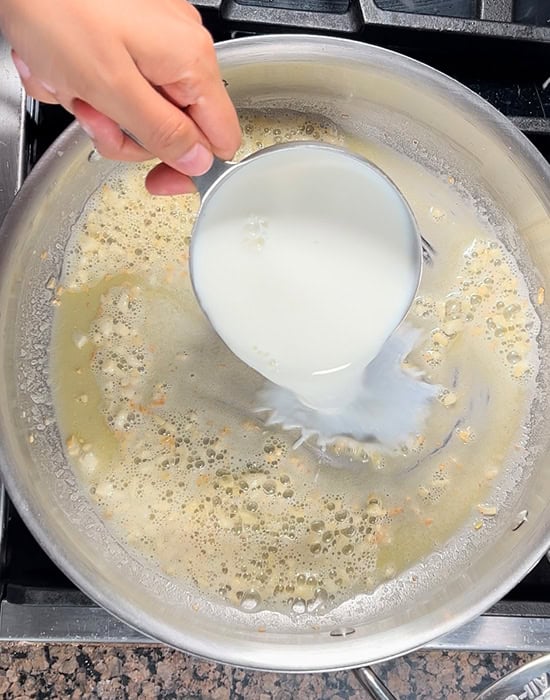 adding milk to a pan