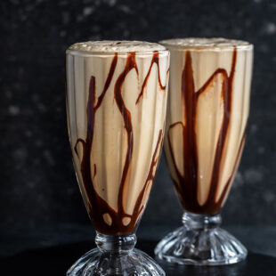 two tall glasses filled with cold coffee