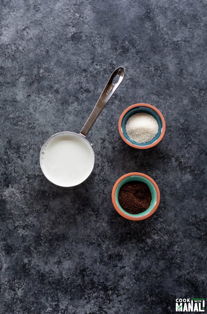 ingredients for cold coffee arranged on a board