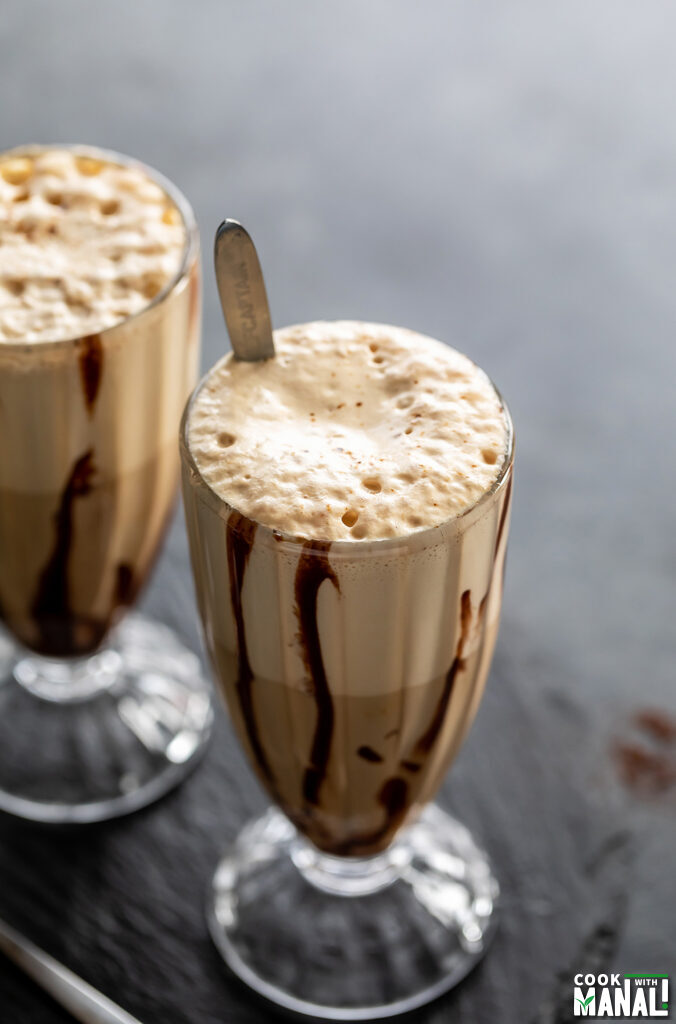 coffee in a tall glass with frothy top