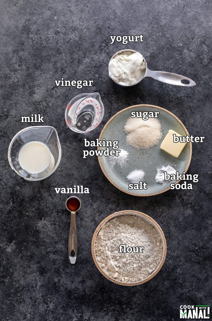 ingredients for making eggless pancakes arranged on a board